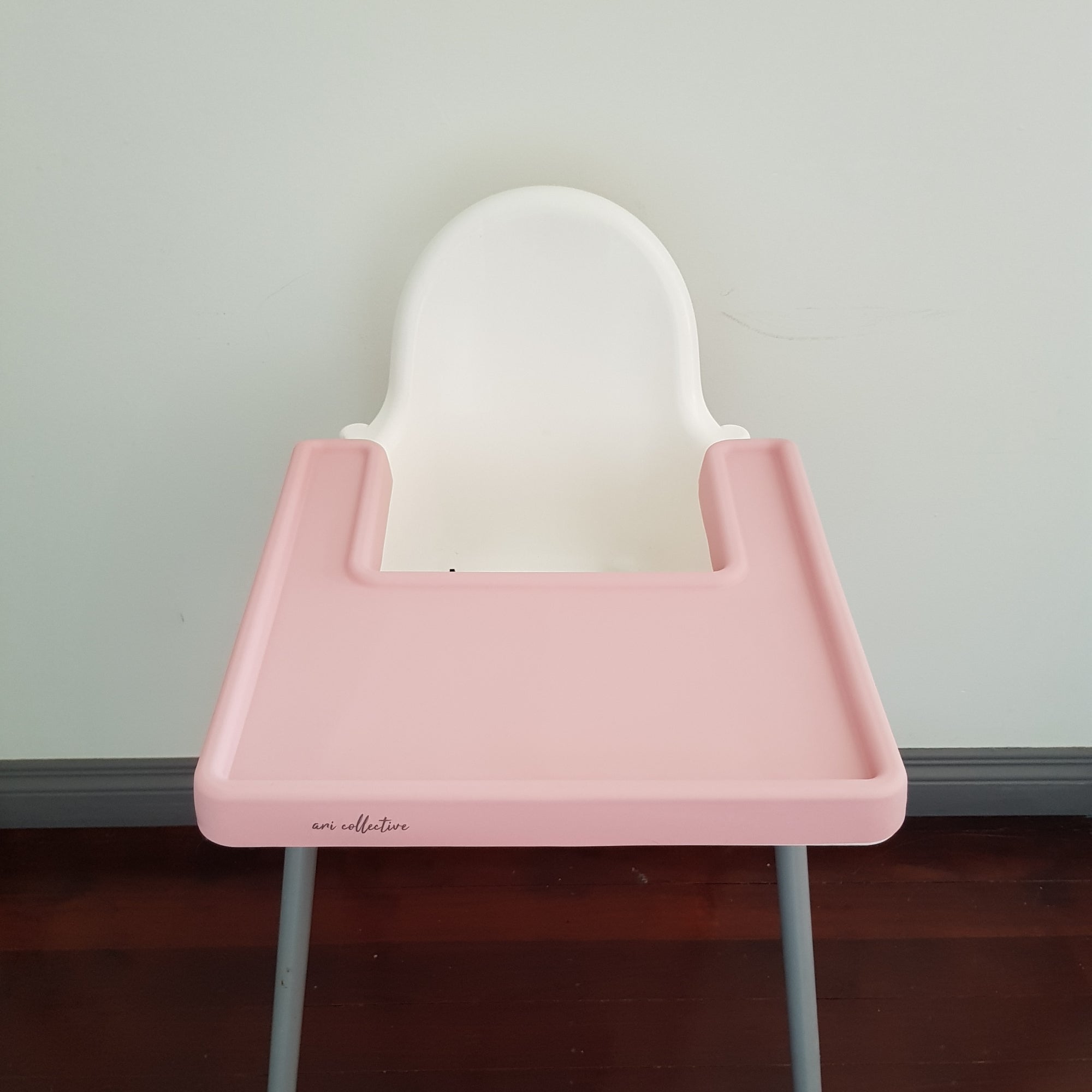 High chair tray outlet cover